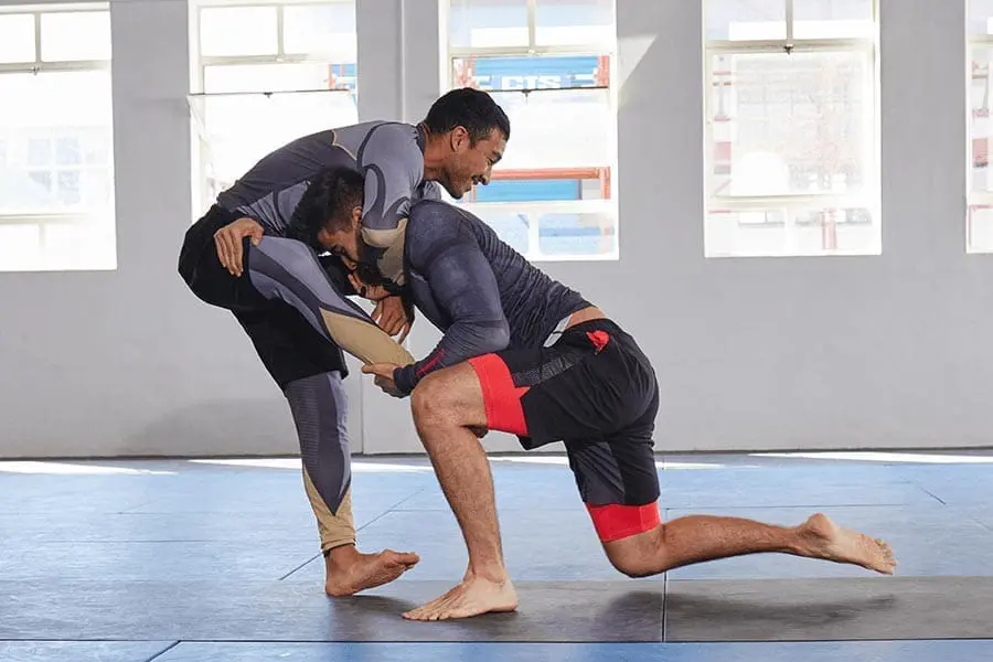 Grapplers practicing standing entries during grappling fundamentals training